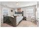 Inviting bedroom features a rustic wood bed frame and soft, natural light from the windows at 543 Pendleton Dr, Moncks Corner, SC 29461