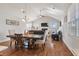 Open concept dining room with hardwood floors, and views of the living room and fireplace at 543 Pendleton Dr, Moncks Corner, SC 29461