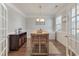 Dining room featuring a wooden island and an elegant chandelier with a view of the entryway at 543 Pendleton Dr, Moncks Corner, SC 29461