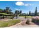 View of the community dog park with green grass and a black fence, providing a safe space for pets at 543 Pendleton Dr, Moncks Corner, SC 29461