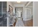 Inviting hallway with hardwood floors, elegant decor, and ample natural light at 543 Pendleton Dr, Moncks Corner, SC 29461