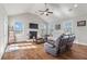 Bright living room with vaulted ceilings, fireplace, ceiling fan, and wood floors at 543 Pendleton Dr, Moncks Corner, SC 29461