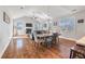 Open-concept living room featuring vaulted ceilings, fireplace, hardwood floors, and comfortable seating area at 543 Pendleton Dr, Moncks Corner, SC 29461