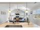 Open-concept kitchen flows into the living room with vaulted ceilings and plentiful natural light at 543 Pendleton Dr, Moncks Corner, SC 29461