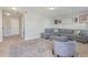 Comfortable living room featuring a large gray sectional, decorative rug, and access to other areas at 543 Pendleton Dr, Moncks Corner, SC 29461