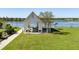 Outdoor pavilion area with picnic tables and lake views surrounded by well-manicured lawn at 543 Pendleton Dr, Moncks Corner, SC 29461