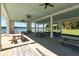 Interior of outdoor pavilion area with picnic tables, fans, and lake views at 543 Pendleton Dr, Moncks Corner, SC 29461