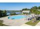 A beautiful community pool area with sunshades and a lake view at 543 Pendleton Dr, Moncks Corner, SC 29461