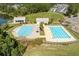 Aerial view features community pools, clubhouse, lake, and surrounding residential neighborhood at 543 Pendleton Dr, Moncks Corner, SC 29461