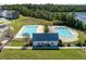 A high angle view displays community pools, clubhouse, and a beautiful waterfront view at 543 Pendleton Dr, Moncks Corner, SC 29461