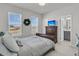 Comfortable bedroom featuring two windows with a lake view, a dresser, and an ensuite bathroom at 565 Blueway Ave, Summerville, SC 29486