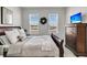 Cozy bedroom with a large window overlooking the lake, stylish furnishings, and ample natural light at 565 Blueway Ave, Summerville, SC 29486