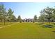 A scenic community park boasts lush green spaces, decorative trees, and a central monument at 565 Blueway Ave, Summerville, SC 29486