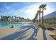 Gorgeous pool with palm trees, lounge chairs and pergolas in a scenic community at 565 Blueway Ave, Summerville, SC 29486
