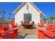 Inviting outdoor fire pit with Adirondack chairs and spacious pavilion providing a charming community area at 565 Blueway Ave, Summerville, SC 29486