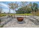 Relaxing outdoor common area with benches surrounding a fire pit at 565 Blueway Ave, Summerville, SC 29486