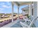 Relaxing front porch view with comfortable seating and views of the neighborhood at 565 Blueway Ave, Summerville, SC 29486