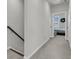 Hallway with the stairs on one side and a bedroom at the end of the hall at 565 Blueway Ave, Summerville, SC 29486