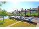 Community park with wooden deck and seating next to a lake with manicured lawns and nearby residences at 565 Blueway Ave, Summerville, SC 29486
