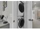 This laundry room features a stacked washer and dryer at 565 Blueway Ave, Summerville, SC 29486