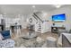Open-concept living area with a staircase and views of the dining and kitchen at 565 Blueway Ave, Summerville, SC 29486