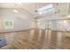 Bright, expansive multipurpose room with hardwood floors, large windows, and ample natural light at 565 Blueway Ave, Summerville, SC 29486