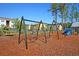 Community playground with swings and slides on mulch ground, offering a fun and safe play area for  at 565 Blueway Ave, Summerville, SC 29486