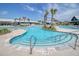 Stunning community pool area with palm trees and ample seating for residents to enjoy at 565 Blueway Ave, Summerville, SC 29486
