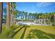 Community pool area with lounge chairs and palm trees, offering a relaxing and recreational space for residents at 565 Blueway Ave, Summerville, SC 29486