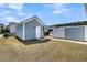 Charming blue shed with white trim and door in the backyard at 565 Blueway Ave, Summerville, SC 29486