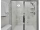 This shower has a glass door with a rain shower head and marble tiling at 565 Blueway Ave, Summerville, SC 29486