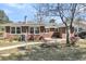 Brick home's exterior highlights the yard's landscaping, architectural style, and outdoor features at 5921 Oak St, Hanahan, SC 29410