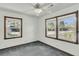 Bright bedroom with two windows letting in natural light and ceiling fan at 5921 Oak St, Hanahan, SC 29410