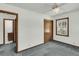 Bedroom with neutral carpet, ceiling fan, closet, and next to the bathroom at 5921 Oak St, Hanahan, SC 29410