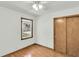 Cozy bedroom with wood flooring, window with view, and large closet at 5921 Oak St, Hanahan, SC 29410