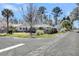 Brick home on a corner lot featuring a mature tree in the front yard with proximity to neighborhood street and sidewalks at 5921 Oak St, Hanahan, SC 29410