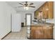 Traditional kitchen with light-colored cabinets, tiled floor, granite countertops, and modern appliances at 5921 Oak St, Hanahan, SC 29410
