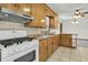 Traditional kitchen featuring an oven and granite counters with a view into the living room at 5921 Oak St, Hanahan, SC 29410