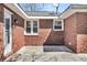 Private brick patio area with multiple windows providing natural light and architectural details at 5921 Oak St, Hanahan, SC 29410