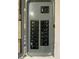 Detailed view of an electrical panel with various circuit breakers and labels at 6601 Dorchester Rd # 109, North Charleston, SC 29418