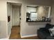 A well-lit kitchen features white cabinetry, modern appliances, and a convenient pass-through to the living area at 6601 Dorchester Rd # 109, North Charleston, SC 29418