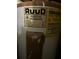 Image of a Ruud water heater with attached labels, highlighting model and energy efficiency information at 6601 Dorchester Rd # 109, North Charleston, SC 29418
