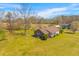 Sprawling property showcases a cozy brick home, nestled in a lush green landscape at 729 2Nd Bend Rd, Harleyville, SC 29448