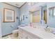Bright bathroom featuring white vanity, floral wallpaper, and natural light from a window at 729 2Nd Bend Rd, Harleyville, SC 29448