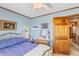 Cozy bedroom featuring charming decor, a brass bed frame, and a traditional wooden door at 729 2Nd Bend Rd, Harleyville, SC 29448