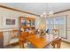 Charming dining room with wood table, chairs, hutch and natural light at 729 2Nd Bend Rd, Harleyville, SC 29448