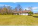 Single-story home with brick facade, attached garage, and charming front porch, perfect curb appeal at 729 2Nd Bend Rd, Harleyville, SC 29448