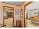 Inviting hallway showcases seamless transition between cozy living area and dining space at 729 2Nd Bend Rd, Harleyville, SC 29448