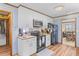 Traditional kitchen features white cabinets, modern appliances, and hardwood floors at 729 2Nd Bend Rd, Harleyville, SC 29448