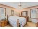 Traditional main bedroom with warm colors, ceiling fan and bright natural light at 729 2Nd Bend Rd, Harleyville, SC 29448
